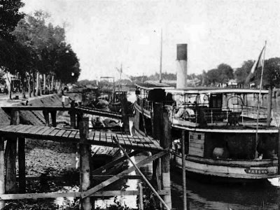 A steamer departing from Mỹ Tho and heading West towards the Mekong Delta